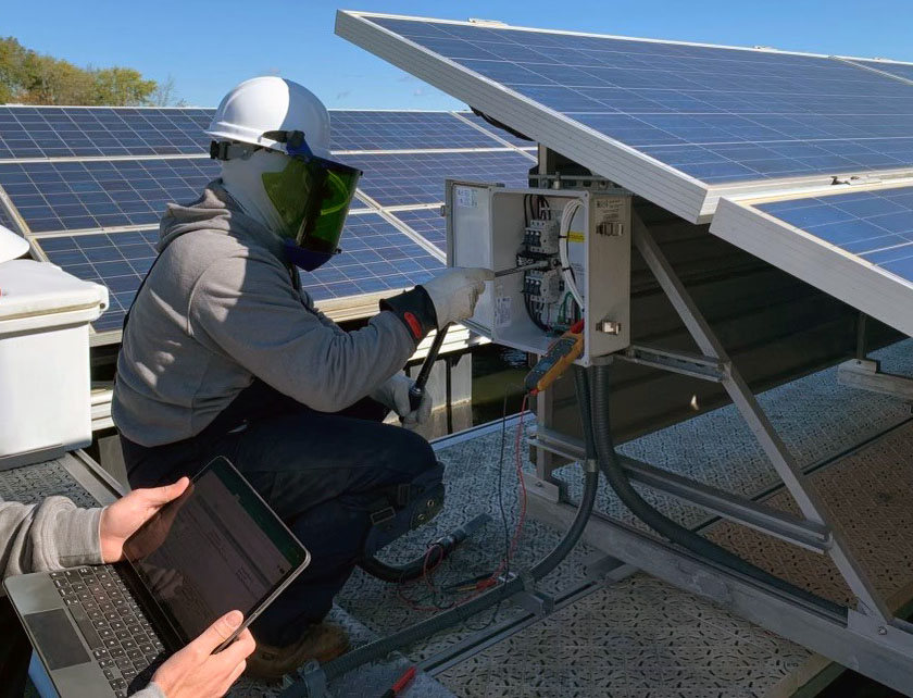 Solar PV technicians performing corrective maintenance